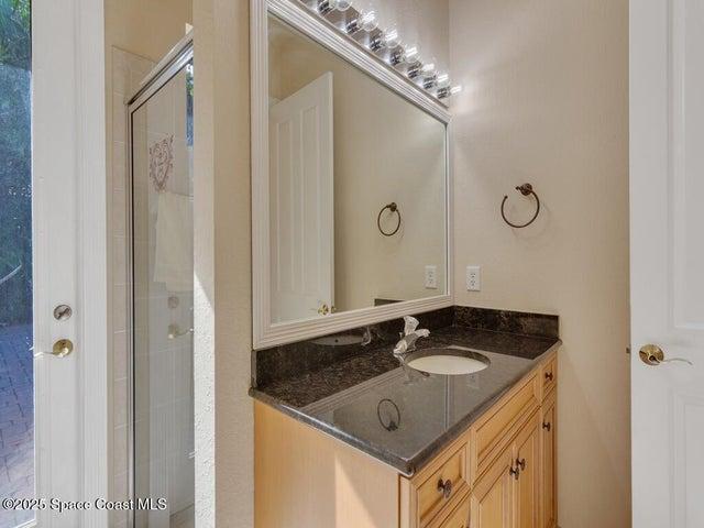 Full bathroom with a stall shower and vanity