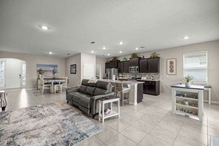 Open concept living area featuring tile flooring throughout