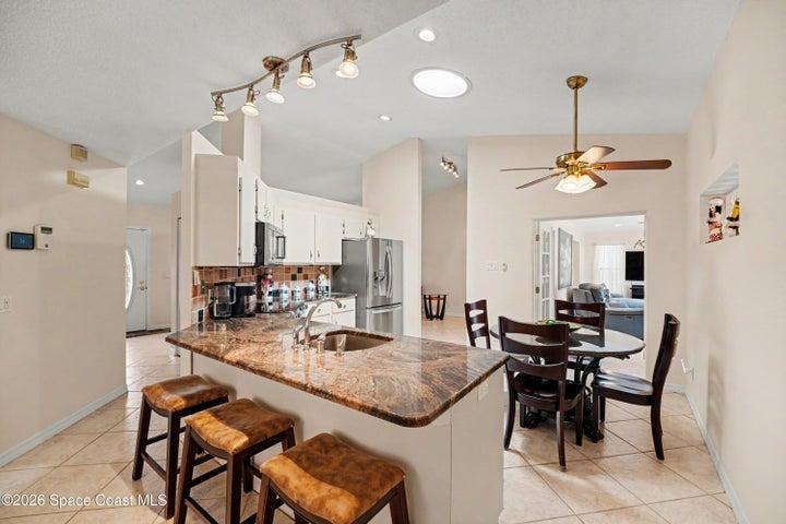 Inviting Kitchen Island with granite countertops