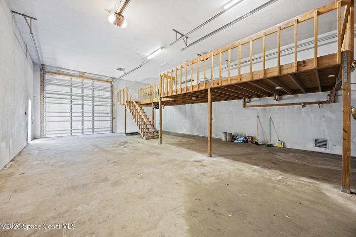 detached garage with three roll up doors