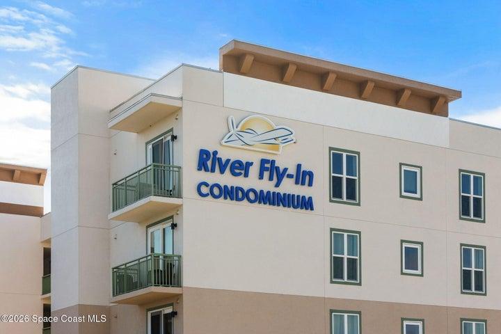 River Fly-In Condominiums at 735 Pilot Lane in Merritt Island, Florida, a luxury waterfront fly-in condo community designed for pilots and aviation enthusiasts, offering marina-style living, private airport access, resort amenities, and a premier Space Coast location near Cocoa Beach, Port Canaveral, Kennedy Space Center, SpaceX, and Blue Origin.