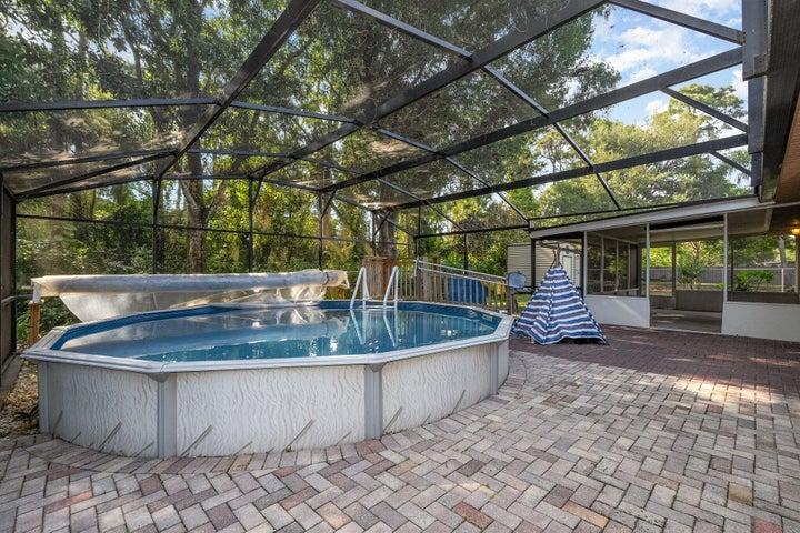 Pool is screened and decked