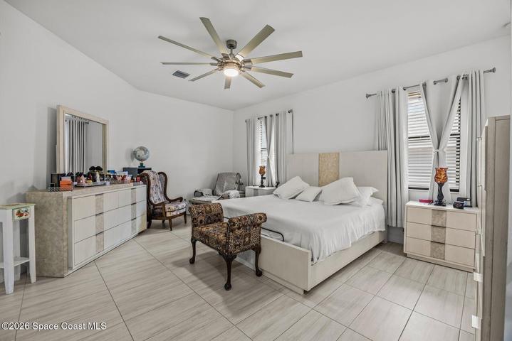 A spacious primary retreat with room to unwind, featuring generous proportions, abundant natural light, and a private ensuite designed for everyday comfort.