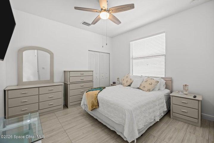 Comfortable and versatile, this secondary bedroom offers generous space for family, guests, or a home office, with a neutral design that's ready to complement any style.