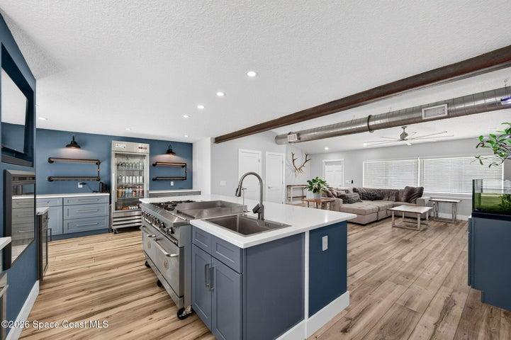 Chef's kitchen featuring commercial-grade appliances.