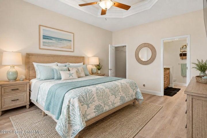 Owner suite on 1st floor with designer ceiling.