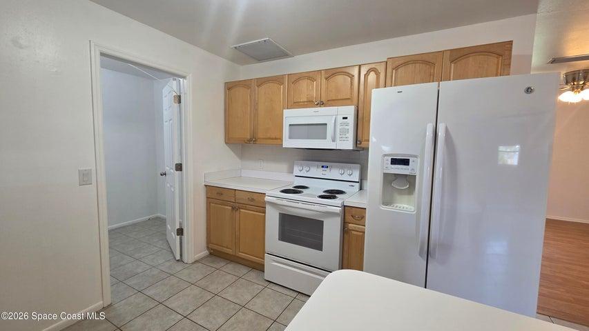 KITCHEN LEADING TO LAUNDRY/UTILITY ROOM