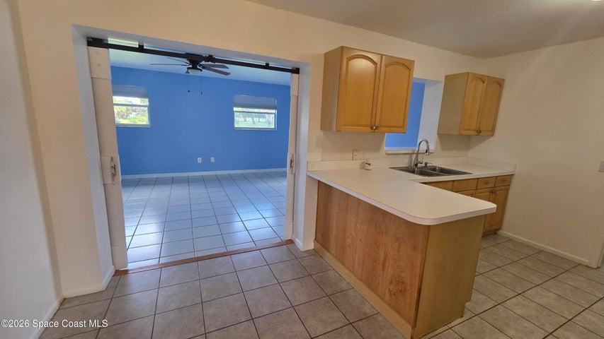 CUSTOM BARN DOORS TO EXPANSIVE FLEX ROOM