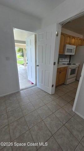 ENTRANCE TO CARPORT FROM UTILITY ROOM