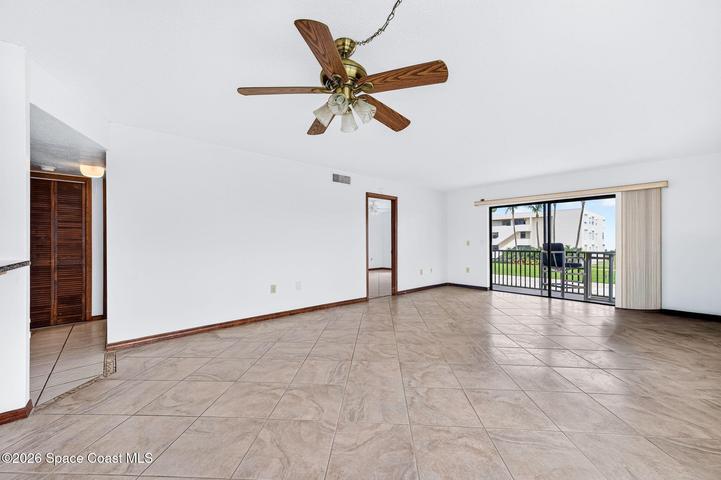 Spacious Family Room Looking to the Back of Condo