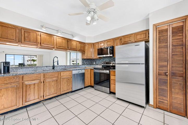 Kitchen to the Back of the Condo