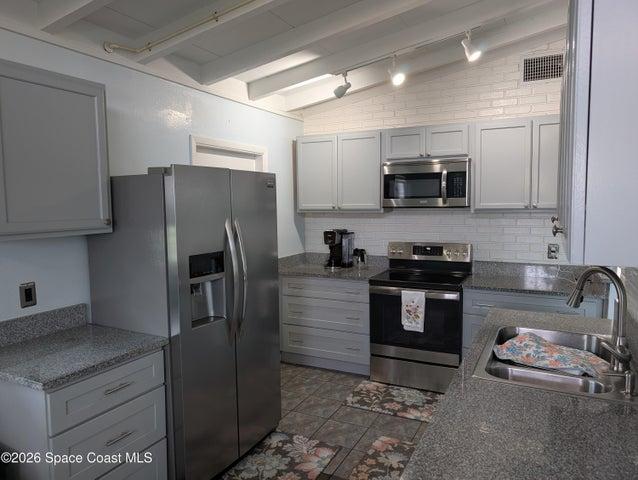 Updated Kitchen with granite and stainless and soft close drawers