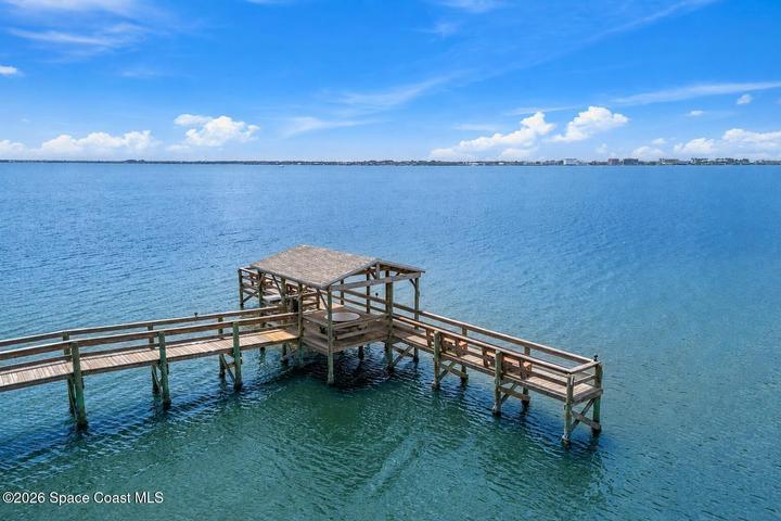 Beach Woods fishing pier extending over the Indian River Lagoon near 3220 River Villa Way Unit 121.