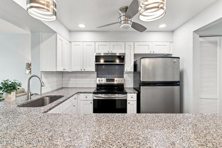 Granite countertops, soft close cabinet and drawers, breakfast island, new fixtures, sink, finishes