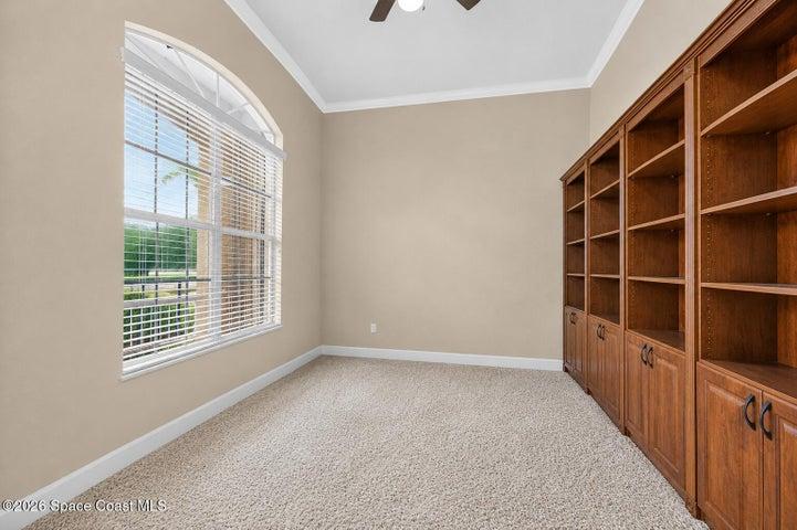 large office in the front of home with built in book case