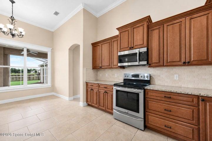Kitchen with eat-in area overlooking pool