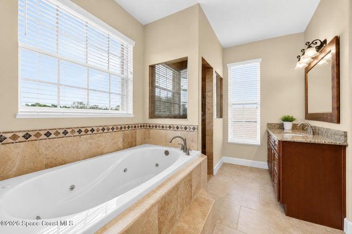 primary bath- walk in shower/ tub/ dual vanities/ toilet closet/ his and hers closets
