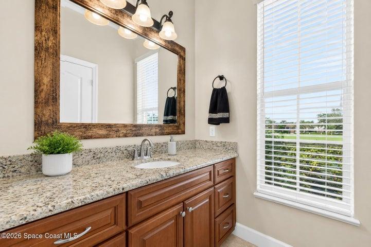 primary bathroom with operate dual vanities