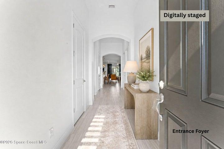 Elegant foyer with soaring ceilings and a welcoming first impression
