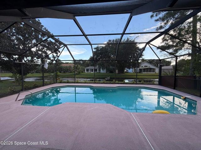 Screened pool overlooking the lake