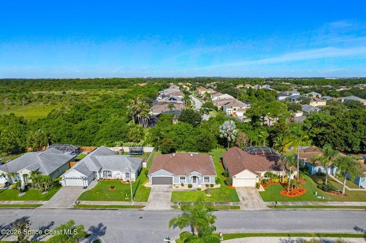 Aerial view showcasing the home’s position within a beautiful community