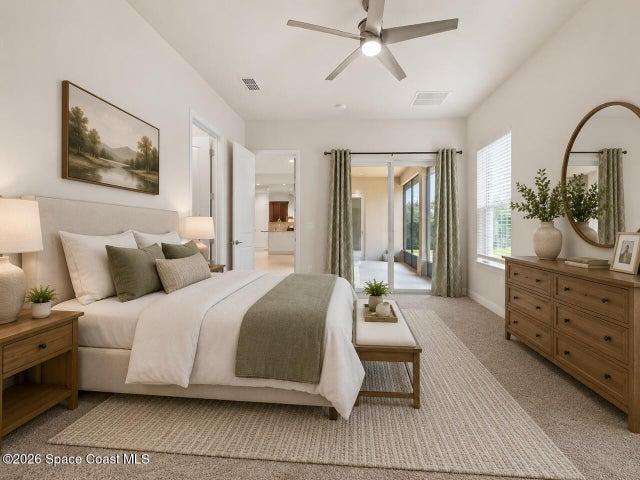 Large primary bedroom has access to screened porch-virtually staged