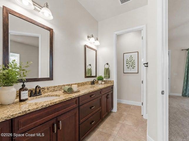 Primary bathroom with double sinks- virtually staged