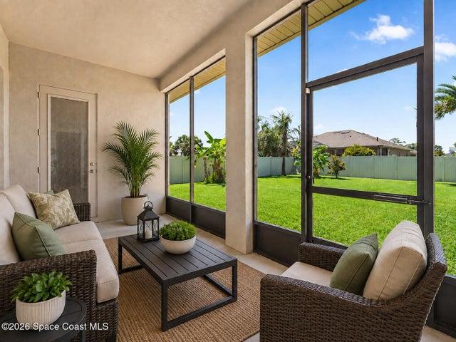 Trussed screened porch-virtually staged