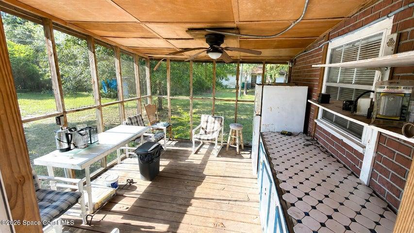 Back enclosed patio. Digitally enhanced