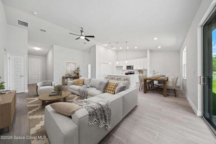 Open Plan Design - Porcelain TIle wood look flooring.