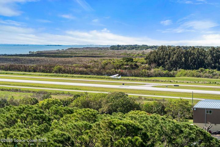 Aircraft arrivals and departures become part of the view from this ninth-floor residence overlooking Merritt Island Airport.