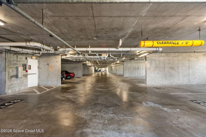 The secured residential garage provides protected resident parking, with separate first-level parking available for guests.