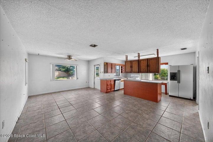 Living room and view of kitchen.