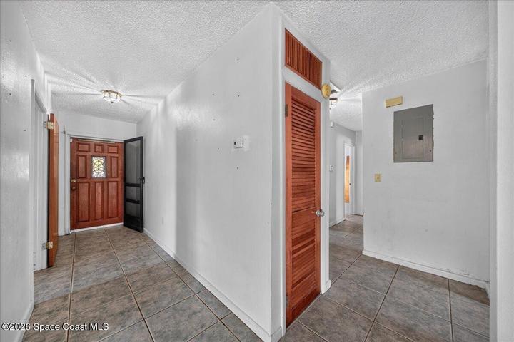Entryway, with bedrooms on the right