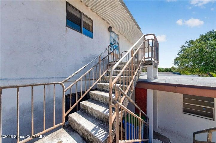 Stairs leading to upstairs unit.
