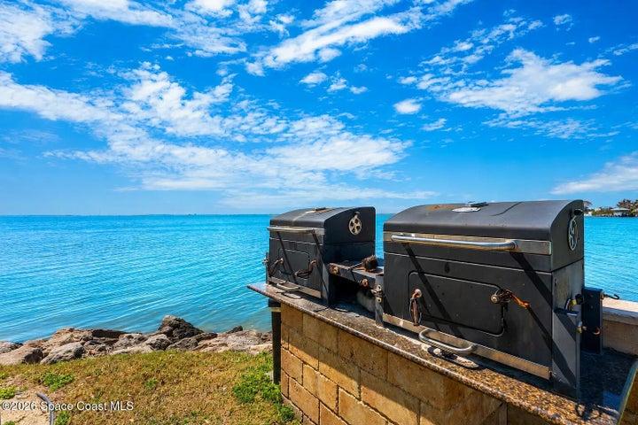 Outdoor barbecue area provides a convenient setting for cooking and gathering with neighbors.