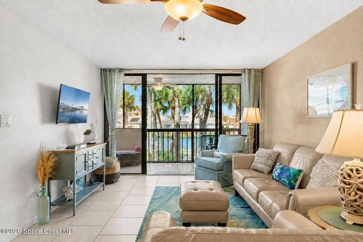 Spacious living room at 300 Columbia Drive Unit 3204 with natural light and views toward the water.
