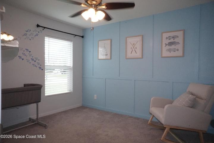Bedroom 2 with accent wall and large closet