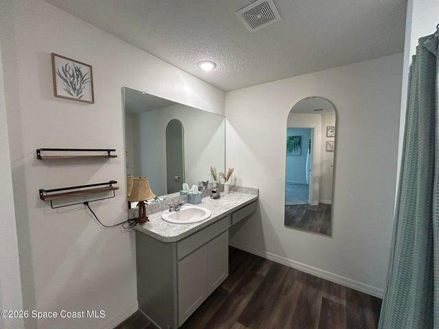 Primary bath features a vanity with drawers!