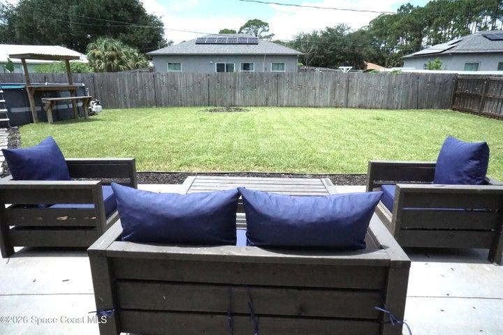 Oversized patio seating with views of entire large back yard.