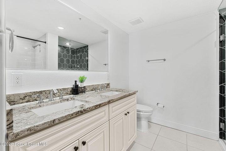 The dual vanity provides generous personal space, storage and everyday functionality within the primary bathroom.