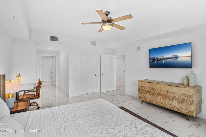 A defined hallway separates the bedroom wing from the main entertaining areas to preserve privacy throughout the residence.