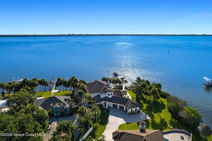 Aerial view showcasing the home with the scenic river nearby