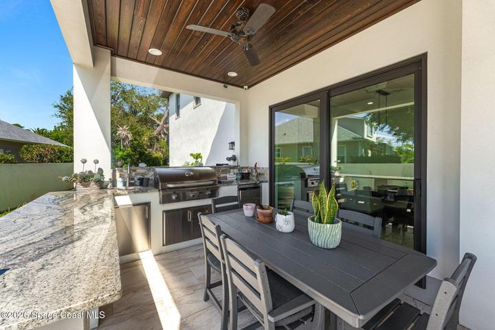 Rear porch offering peaceful views of the sparkling water