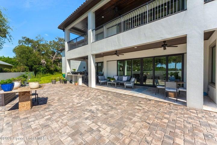 Charming poolside porch designed for year-round indoor-outdoor living