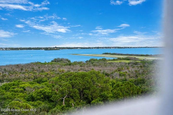 Water and protected green space create a peaceful natural backdrop beyond the aviation activity of Merritt Island Airport.