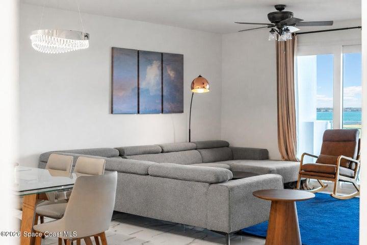 Windows and sliding glass doors frame elevated views of Merritt Island Airport, Sykes Creek and the protected landscape beyond River Fly-In.
