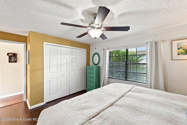 Second bedroom filled with natural light with a closet.