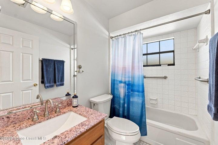 Freshly painted second bathroom featuring a bathtub and a clean, refreshed feel.