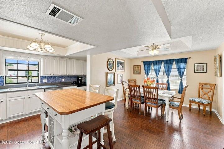 Enjoy the spacious eat-in kitchen, featuring a Kitchen island with seating and an open layout that flows seamlessly into the dining room, making it easy to entertain guests while preparing a meal.